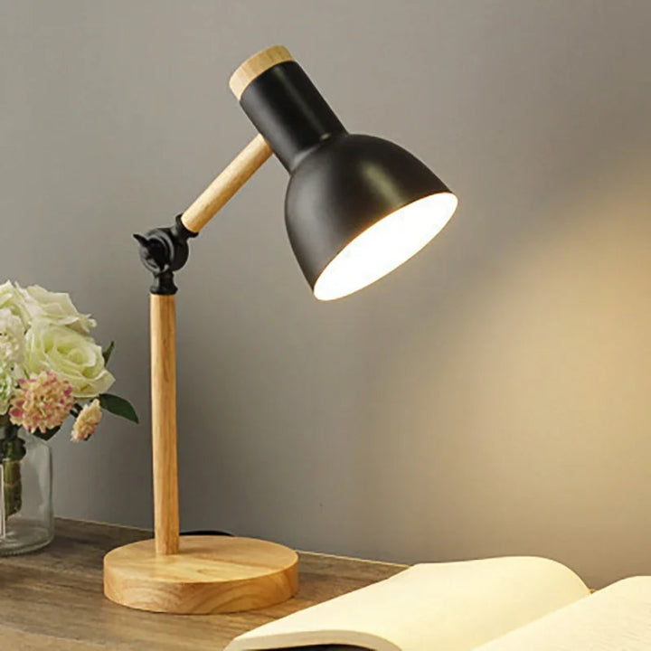 Cozy desk setup with wooden table lamp