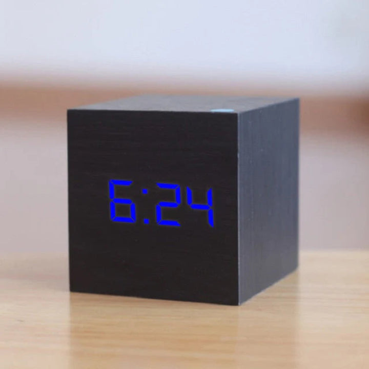 Clock on a cozy nightstand with dim display
